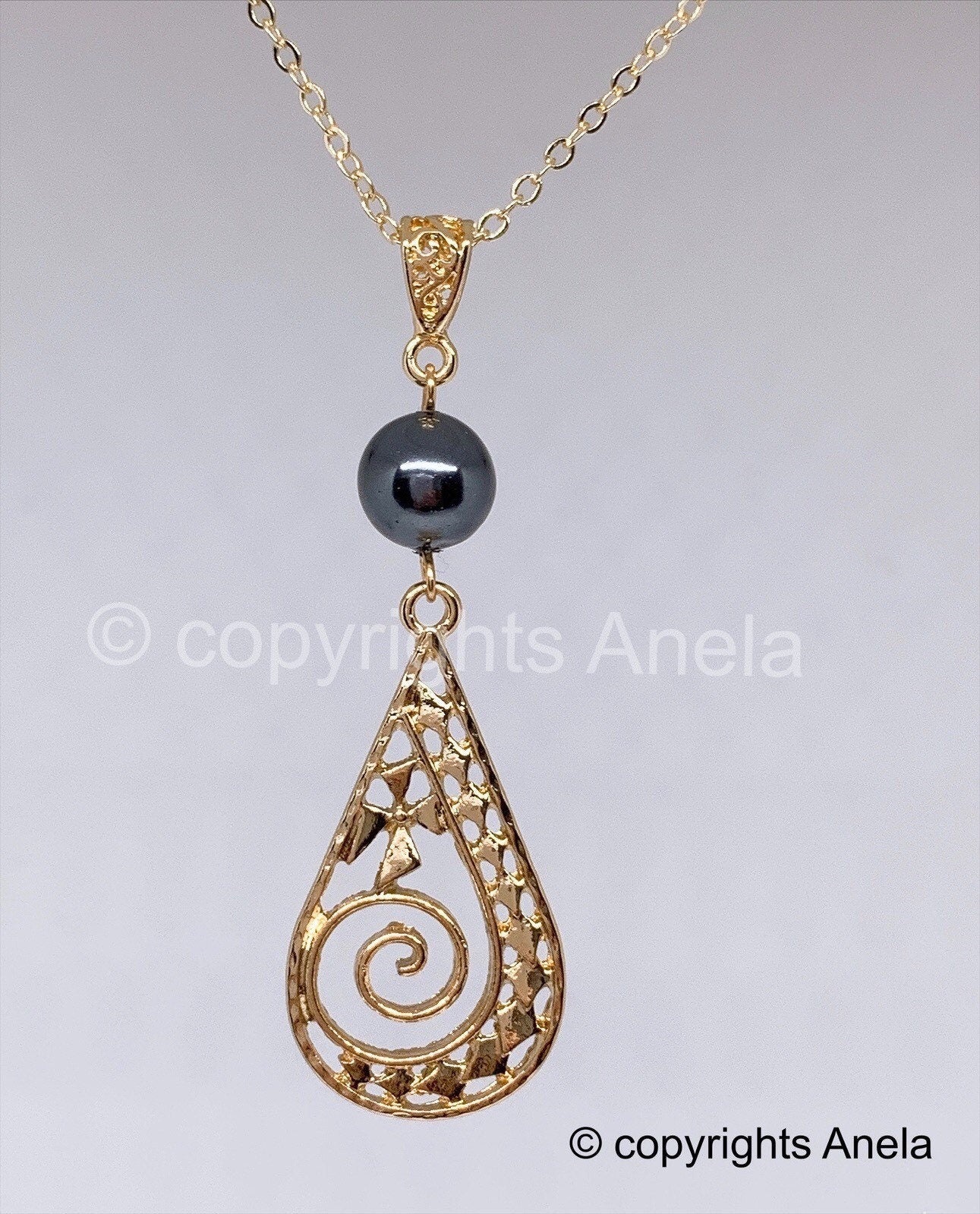 Spiral Polynesian Spear head: Hamilton Gold Necklace with Shell Pearls Fern opening