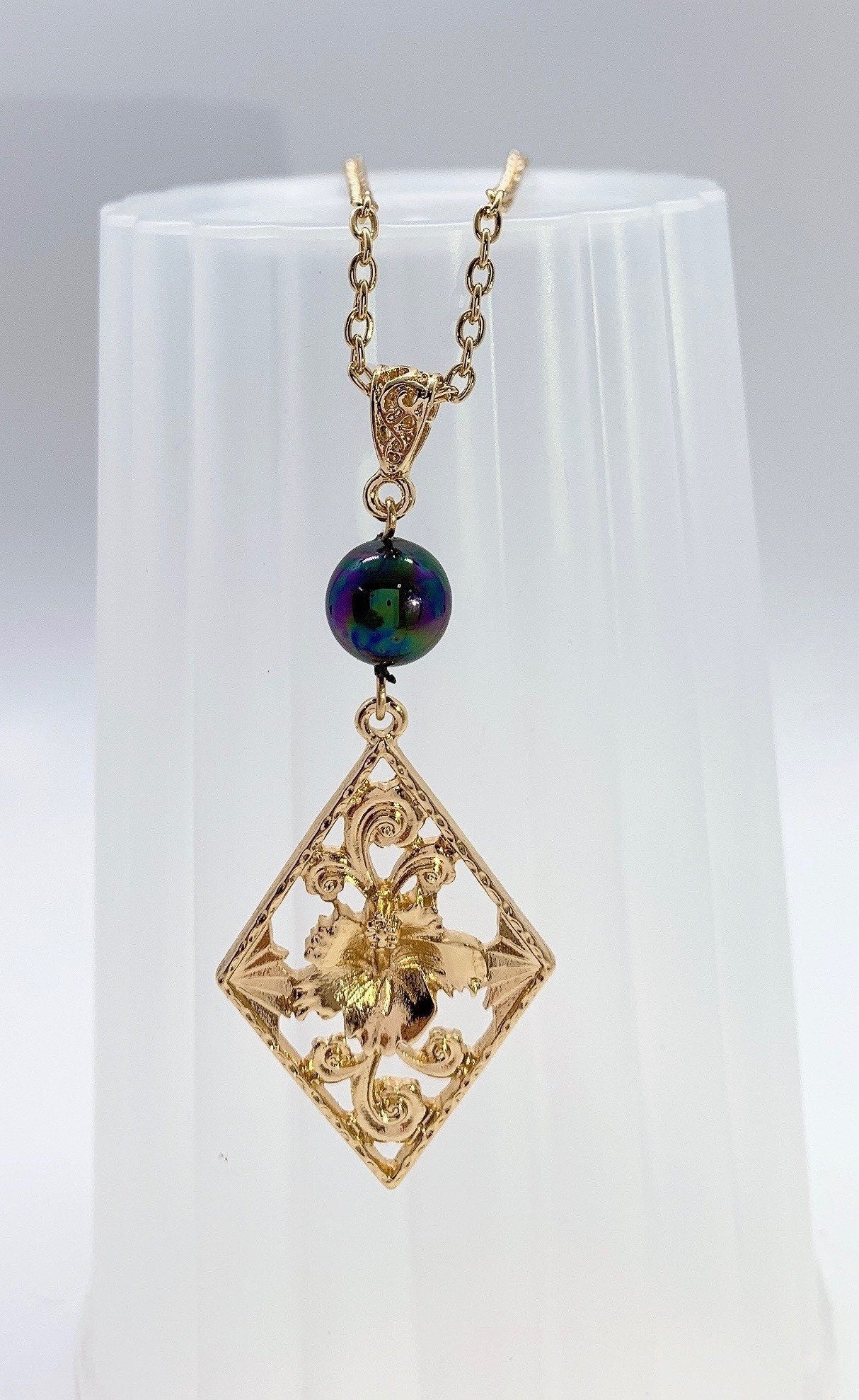 Hibiscus Flower Rectangle: Hamilton Gold Necklace with rainbow Shell Pearls