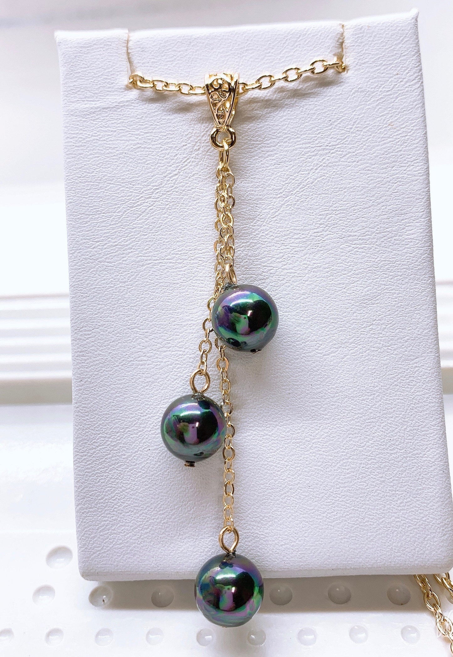 Triple drop: Hamilton Gold Earring with Peacock Black Color Shell Pearls