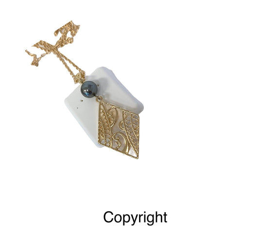 Hawaiian Wind Wave Tribal Design: Hamilton Gold Necklace with Shell Pearls